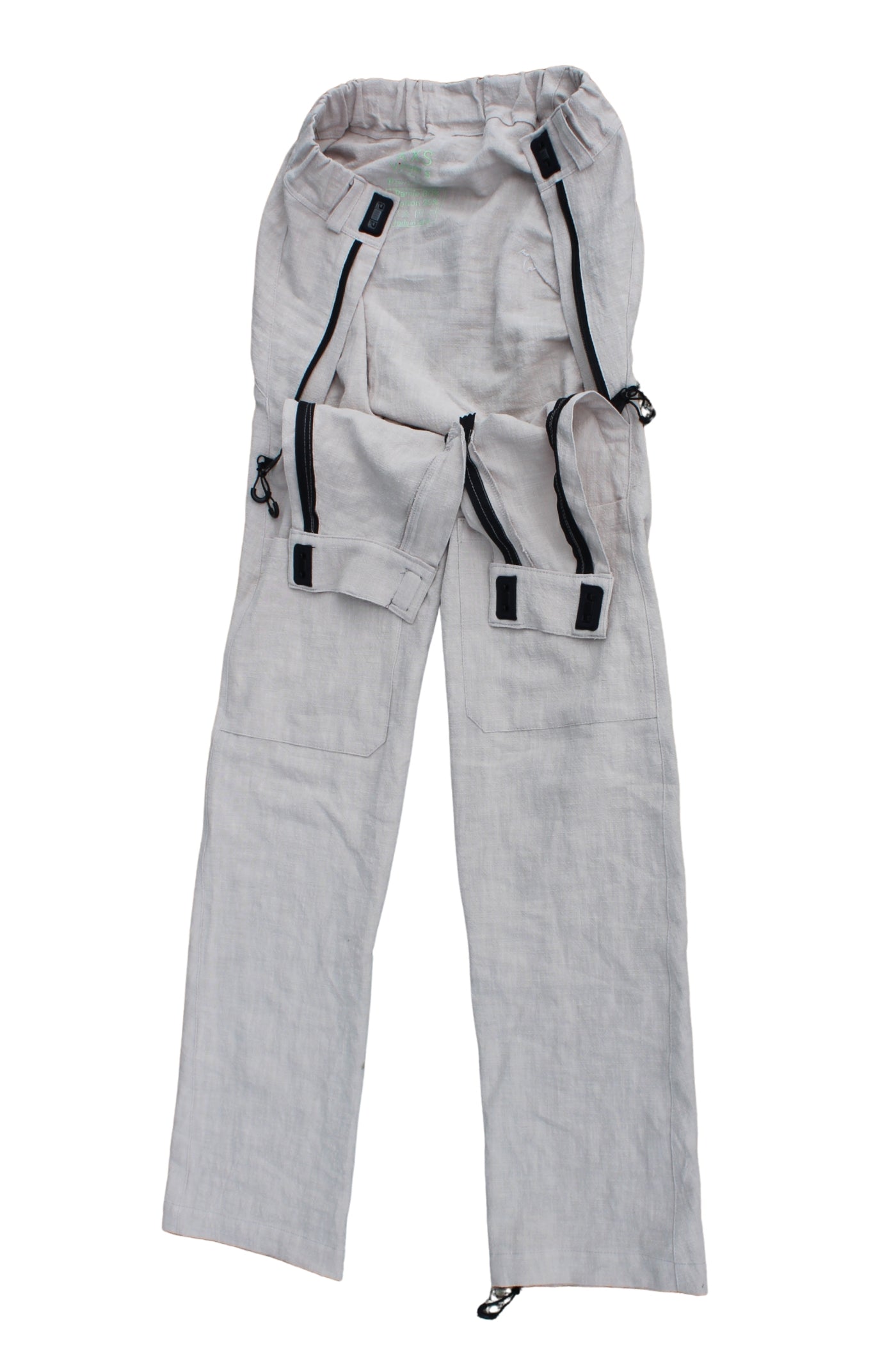Close view of Vilber's adaptive trousers showing the hidden front access panel with magnetic hook-and-hook closure and zip, disguised as a pocket.